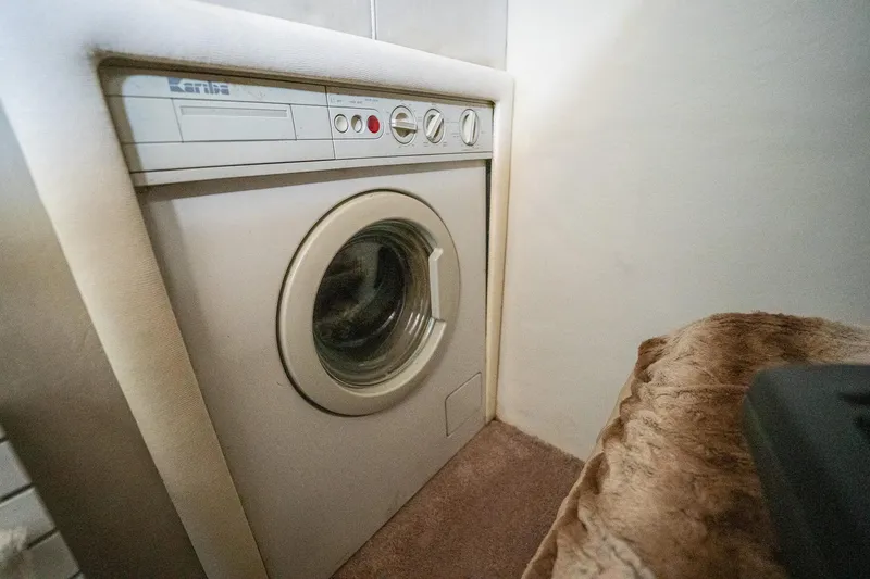 Slide: The Image of Washing machine inside 1995 Sea Ray 550 Sedan Bridge yacht interior. - 33