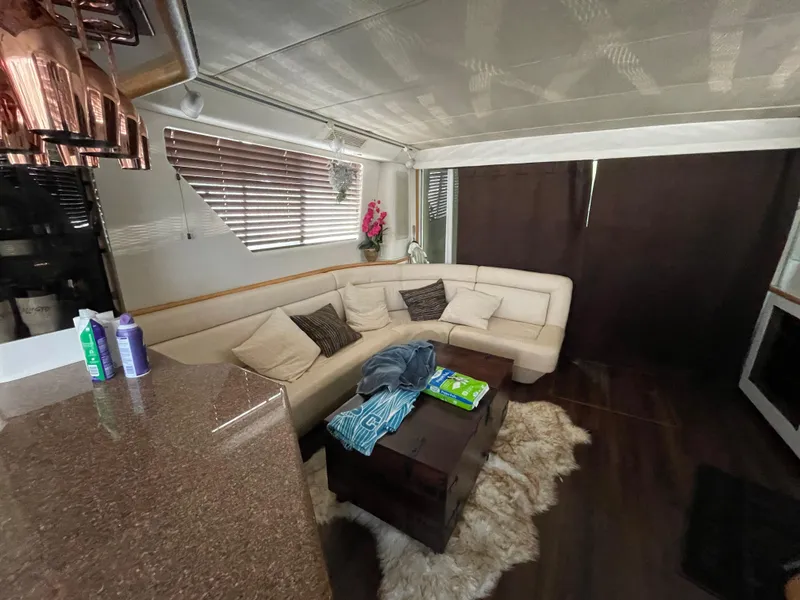 Slide: The Image of Luxurious interior of 1995 Sea Ray 550 Sedan Bridge with plush seating and modern decor. - 35