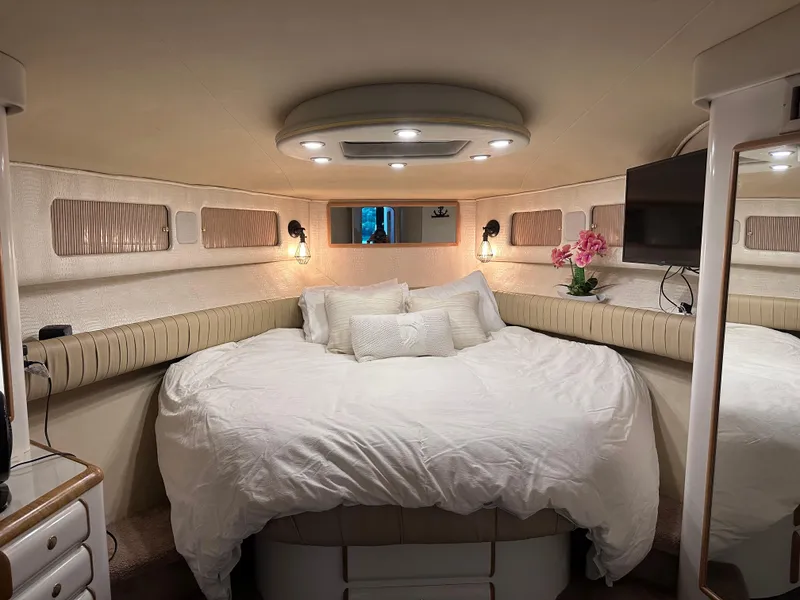 Slide: The Image of Luxurious bedroom interior of 1995 Sea Ray 550 Sedan Bridge yacht. - 39