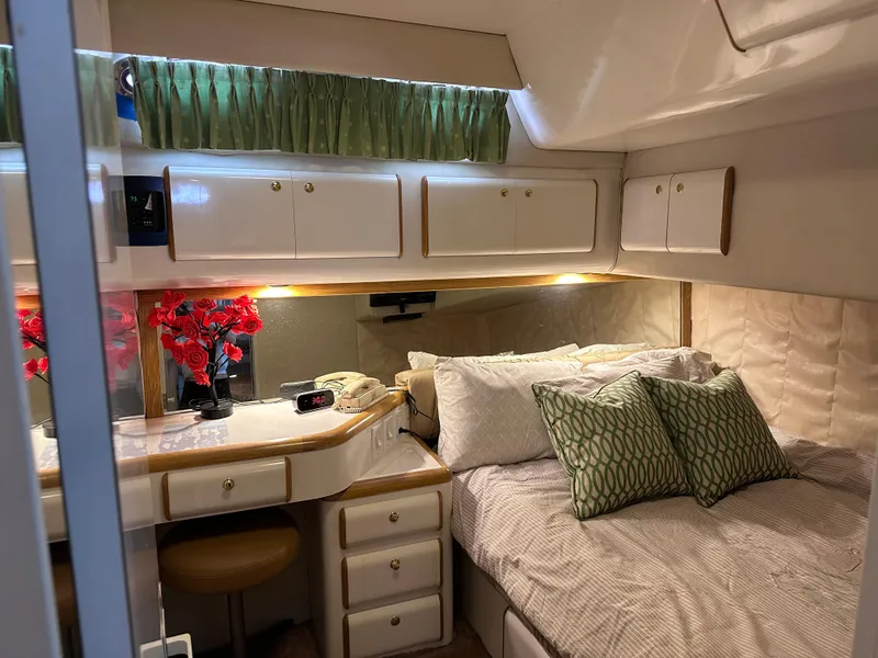 Slide: The Image of Cozy bedroom in 1995 Sea Ray 550 Sedan Bridge yacht with elegant decor. - 40