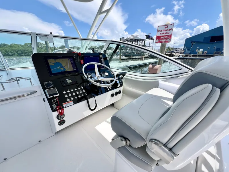 Slide: The Image of 2022 Stamas 326 Aegean boat cockpit with modern controls and comfortable seating. - 13