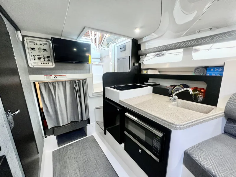 Slide: The Image of 2022 Stamas 326 Aegean boat interior with modern kitchen and seating area. - 21