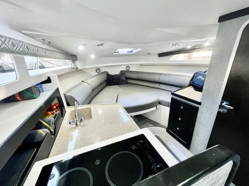 Slide: The Image of 2022 Stamas 326 Aegean boat interior with modern kitchen and seating area. - 23