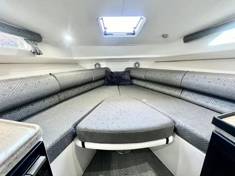 Slide: The Image of 2022 Stamas 326 Aegean boat interior with cushioned seating and overhead hatch. - 25