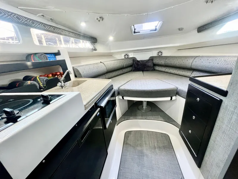 Slide: The Image of 2022 Stamas 326 Aegean boat interior with modern kitchen and cozy seating area. - 26