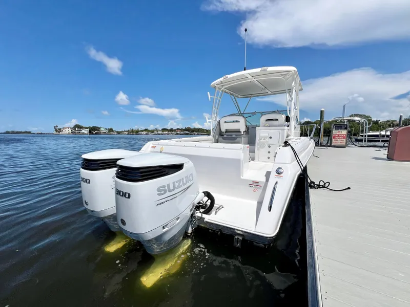 Slide: The Image of 2022 Stamas 326 Aegean boat with twin Suzuki engines docked by the water. - 3