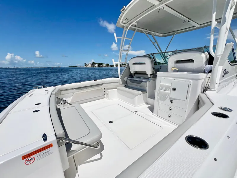 Slide: The Image of 2022 Stamas 326 Aegean boat interior with seating and storage, on a sunny day by the water. - 4