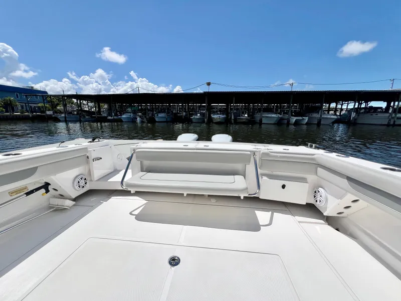 Slide: The Image of 2022 Stamas 326 Aegean boat deck with seating, docked under clear blue sky. - 7