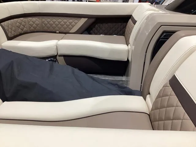 Slide: The Image of Luxurious seating on 2024 Godfrey Aqua Patio Entertainment 255 CBE boat, featuring quilted upholstery. - 13