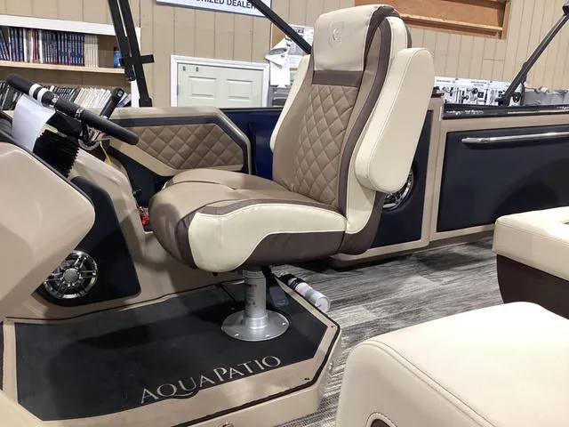 Slide: The Image of 2024 Godfrey Aqua Patio Entertainment 255 CBE boat interior with luxurious seating. - 16