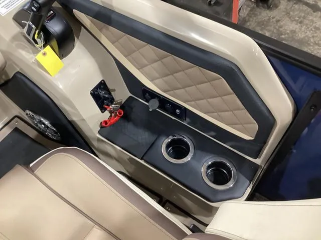 Slide: The Image of 2024 Godfrey Aqua Patio Entertainment 255 CBE interior with cup holders and quilted paneling. - 21