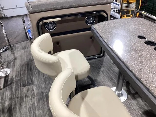 Slide: The Image of 2024 Godfrey Aqua Patio Entertainment 255 CBE interior with seating and table. - 24