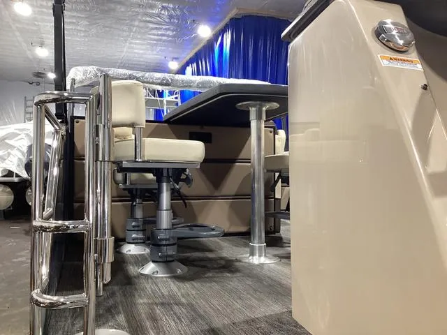 Slide: The Image of 2024 Godfrey Aqua Patio Entertainment 255 CBE interior with seating and table. - 7