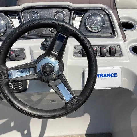 Slide: The Image of 2019 Godfrey Sw2286SB boat dashboard with steering wheel and gauges. - 3