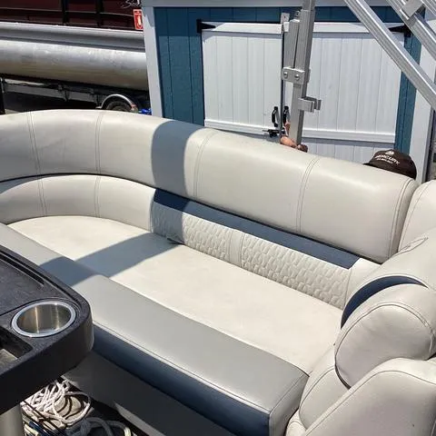 Slide: The Image of 2019 Godfrey Sw2286SB pontoon boat with white leather seating. - 9