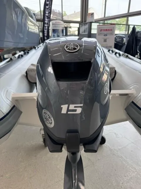 Slide: The Image of 2024 Highfield Classic 310 with Yamaha 15HP outboard motor in showroom. - 4