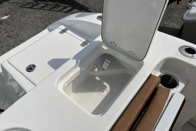 Slide: The Image of 2025 Sea Pro 222 DLX boat interior with open storage compartment. - 10