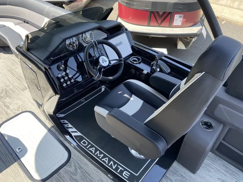 Slide: The Image of 2025 Viaggio Diamante 24S boat cockpit with modern steering and controls. - 12