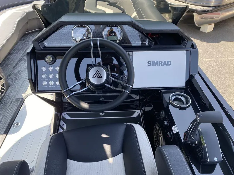 Slide: The Image of 2025 Viaggio Diamante 24S boat dashboard with Simrad display and modern steering wheel. - 13