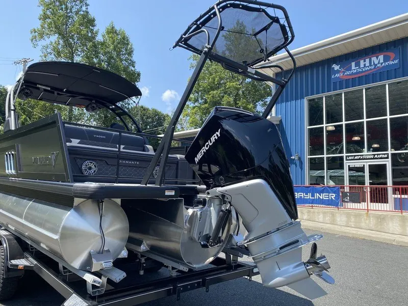 Slide: The Image of 2025 Viaggio Diamante 24S pontoon boat with Mercury engine at marina. - 4