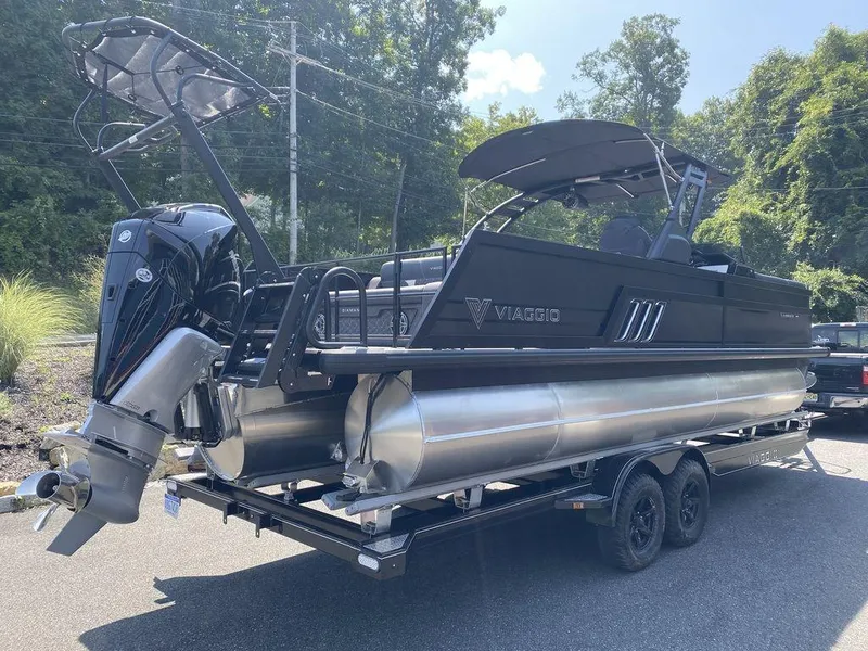 Slide: The Image of 2025 Viaggio Diamante 24S pontoon boat on trailer, sleek black design. - 5