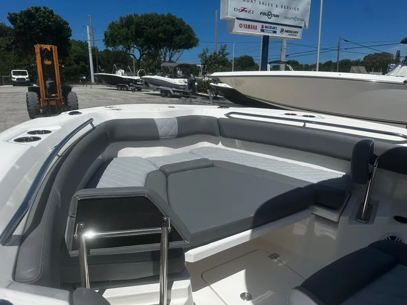 Slide: The Image of 2024 NauticStar 242 OSL boat interior with gray seating and sleek design. - 18