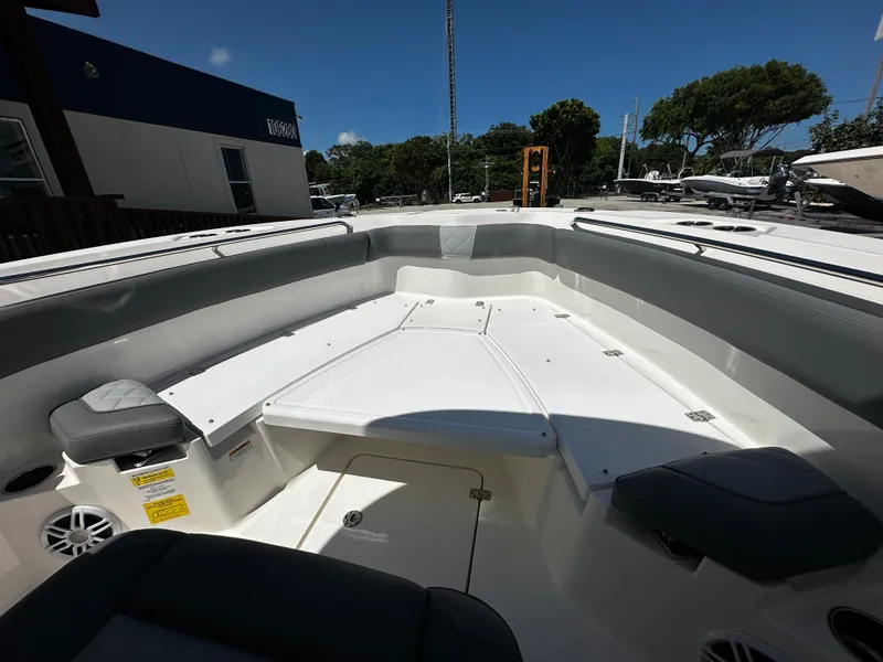 Slide: The Image of 2024 NauticStar 242 OSL boat interior with spacious seating and sleek design. - 9