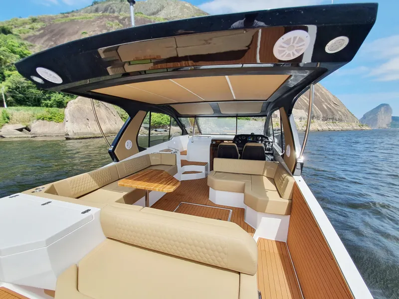 Slide: The Image of Luxurious 2025 Hanover 387 boat interior with spacious seating and scenic water view. - 3