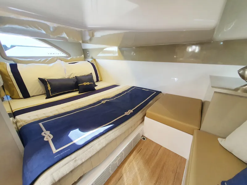 Slide: The Image of Luxurious cabin interior of 2025 Hanover 387 yacht with elegant bedding and seating. - 6