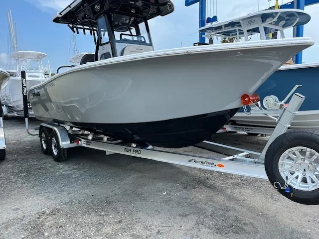 Slide: The Image of 2025 Sea Pro 245 FLX boat on trailer, displayed outdoors. - 1