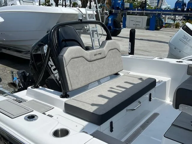 Slide: The Image of 2025 Sea Pro 245 FLX boat with Suzuki engine, featuring comfortable seating. - 14