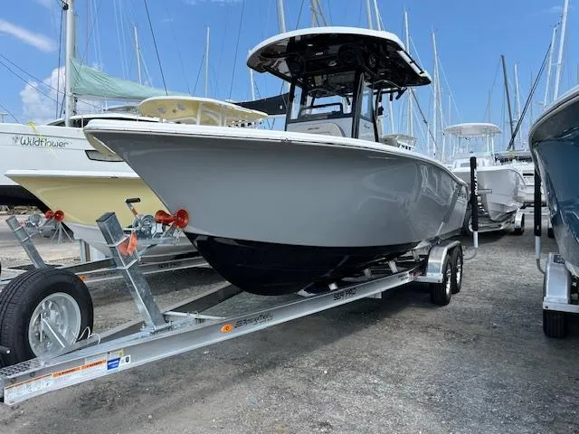 Slide: The Image of 2025 Sea Pro 245 FLX boat on trailer at marina. - 2