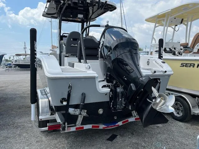 Slide: The Image of 2025 Sea Pro 245 FLX boat with powerful outboard motor on trailer. - 3