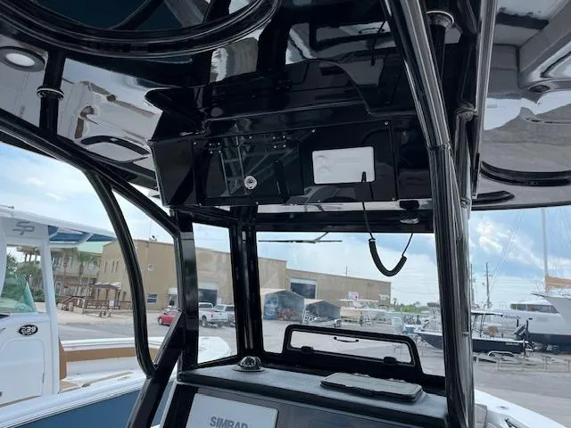 Slide: The Image of 2025 Sea Pro 245 FLX boat interior with advanced navigation equipment. - 6