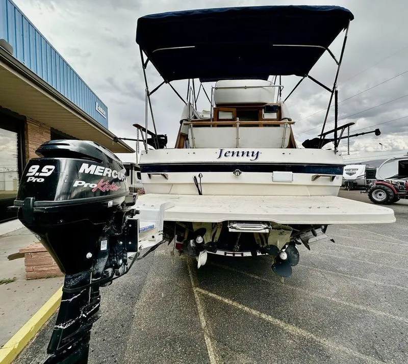 Slide: The Image of 1986 Bayliner 2850 Command Bridge boat with Mercury 9.9 ProKicker motor. - 3