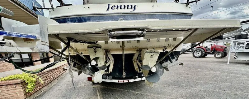 Slide: The Image of 1986 Bayliner 2850 Command Bridge boat stern view with dual propellers. - 6