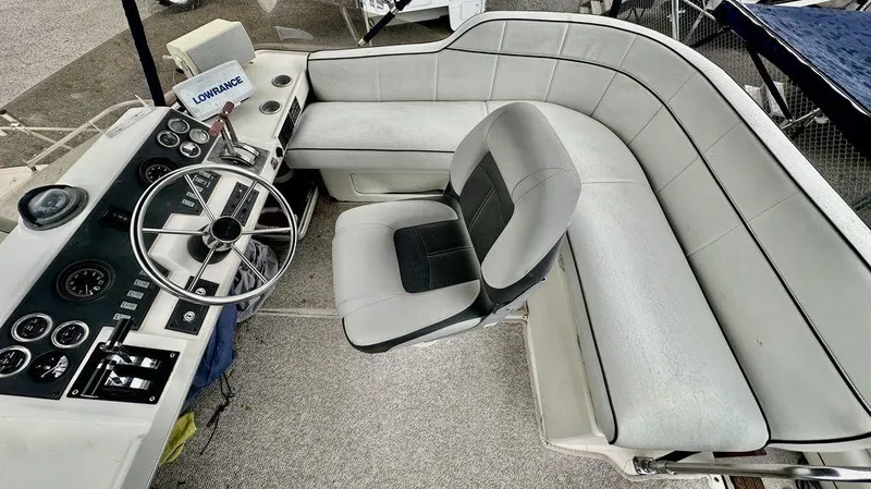 Slide: The Image of 1986 Bayliner 2850 Command Bridge interior with steering wheel and seating area. - 7