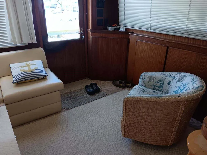 Slide: The Image of Interior of 1988 Hatteras 48 Convertible yacht with nautical decor and seating. - 15