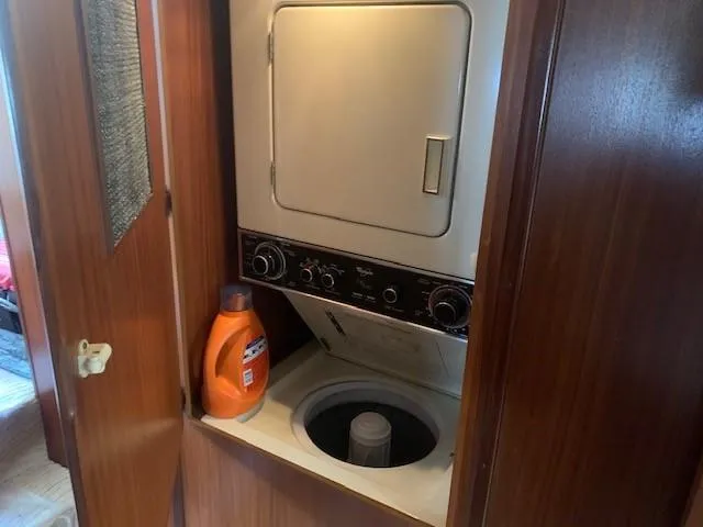 Slide: The Image of Laundry area with washer-dryer in 1988 Hatteras 48 Convertible yacht. - 25