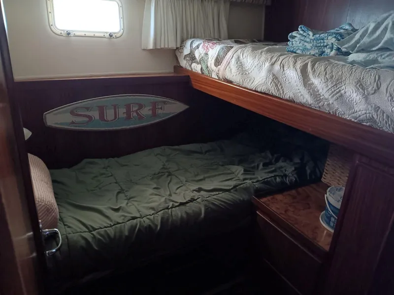 Slide: The Image of Cozy cabin interior of 1988 Hatteras 48 Convertible yacht with bunk beds. - 29
