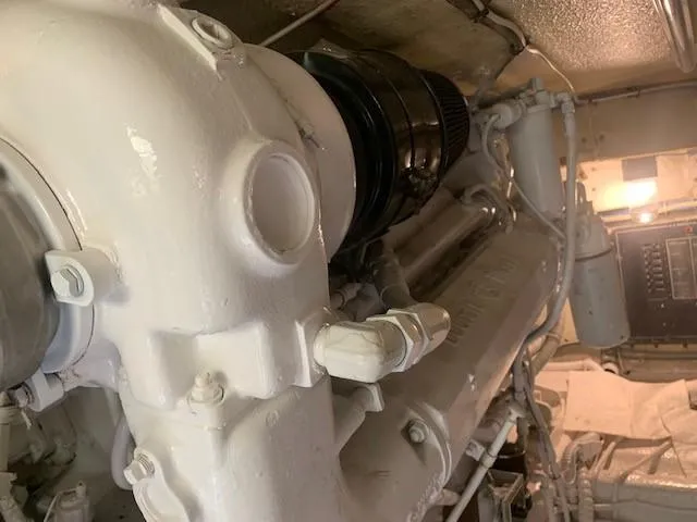 Slide: The Image of Engine room of 1988 Hatteras 48 Convertible yacht, showcasing machinery and components. - 48