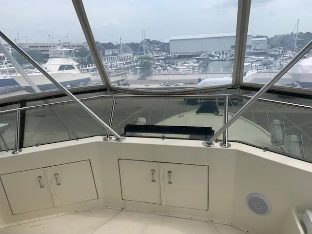 Slide: The Image of 1988 Hatteras 48 Convertible yacht interior with marina view. - 9