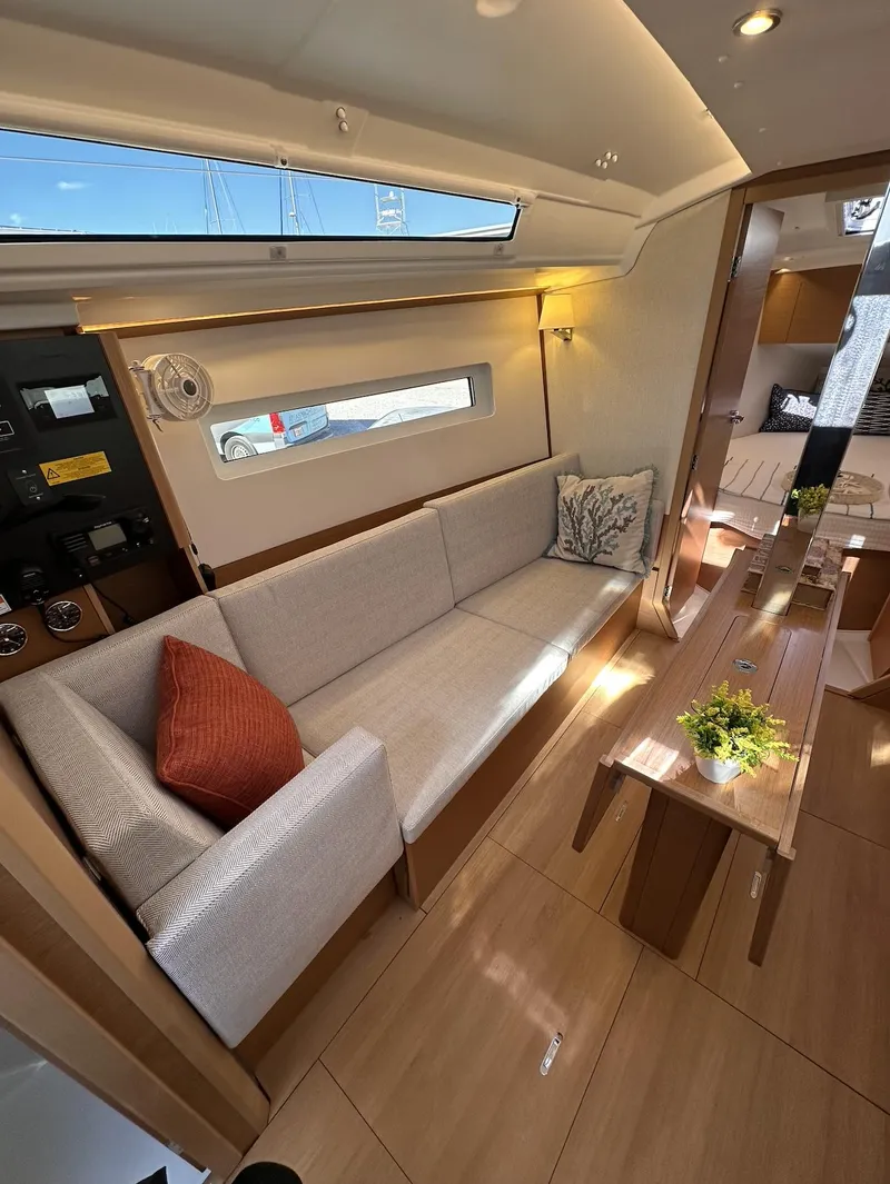 Slide: The Image of Interior of 2025 Jeanneau Sun Odyssey 350 yacht, featuring modern seating and decor. - 5