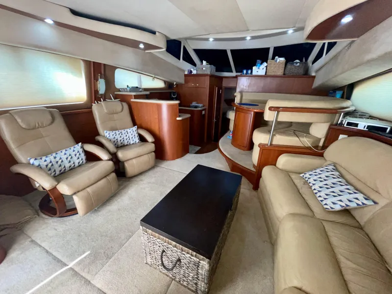 Slide: The Image of Luxurious interior of 2006 Silverton 43 Sport Bridge yacht with leather seating and modern decor. - 2