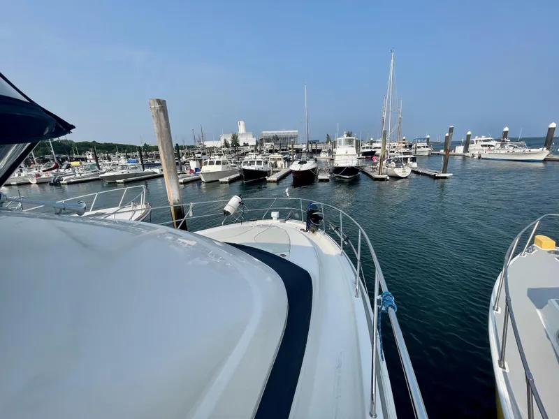 Slide: The Image of 2006 Silverton 43 Sport Bridge yacht docked in a marina. - 34