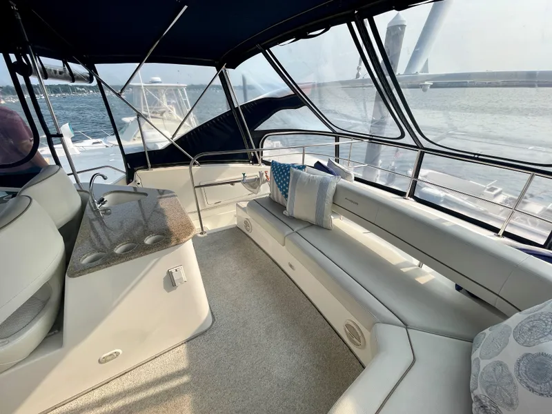 Slide: The Image of Luxurious interior of 2006 Silverton 43 Sport Bridge yacht with elegant seating and ocean view. - 35