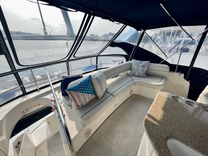Slide: The Image of Luxurious interior of 2006 Silverton 43 Sport Bridge yacht with plush seating and scenic views. - 37