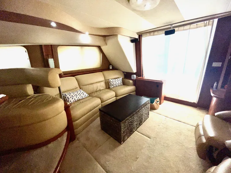 Slide: The Image of Luxurious interior of 2006 Silverton 43 Sport Bridge yacht with plush seating and modern decor. - 4