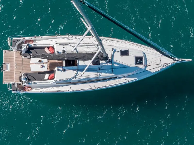 Slide: The Image of Aerial view of 2025 Jeanneau 380 sailboat on turquoise water. - 4