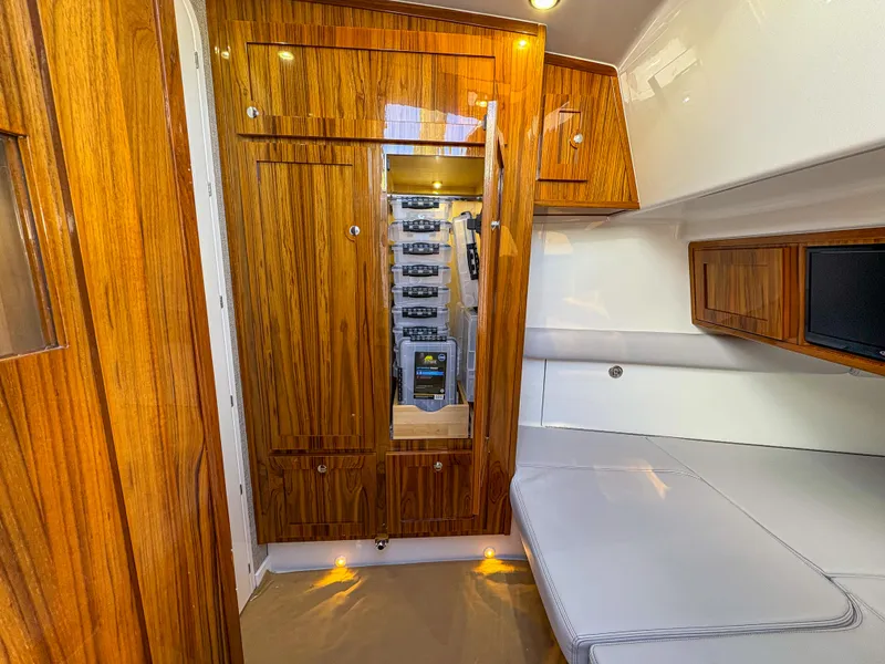 Slide: The Image of 2024 HCB 53' Suenos cabin interior with wood paneling and seating area. - 21